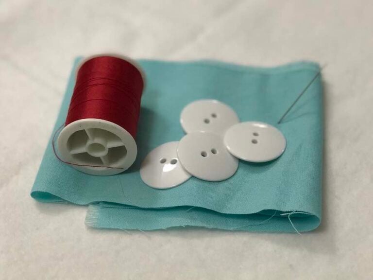 How to Sew a Twohole Button By Hand