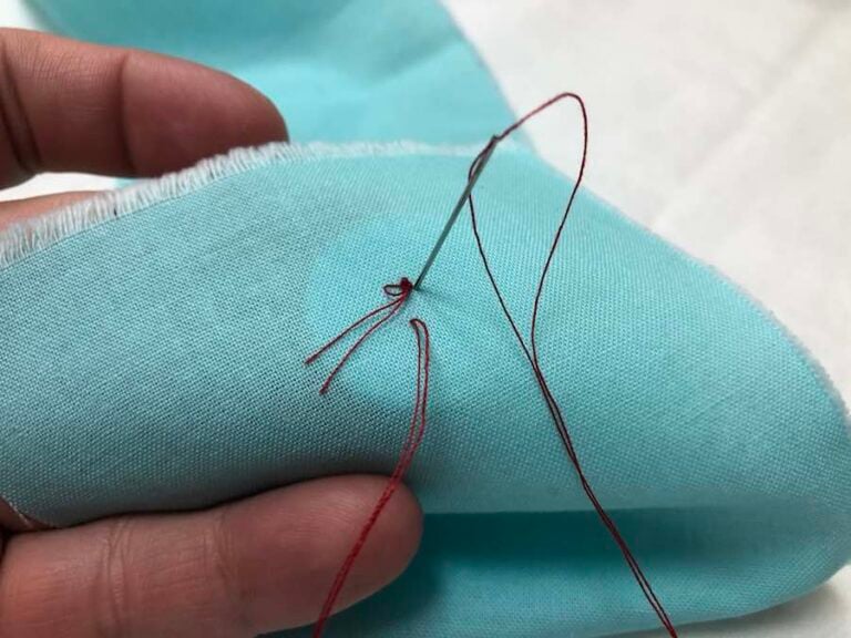 How to Sew a Twohole Button By Hand