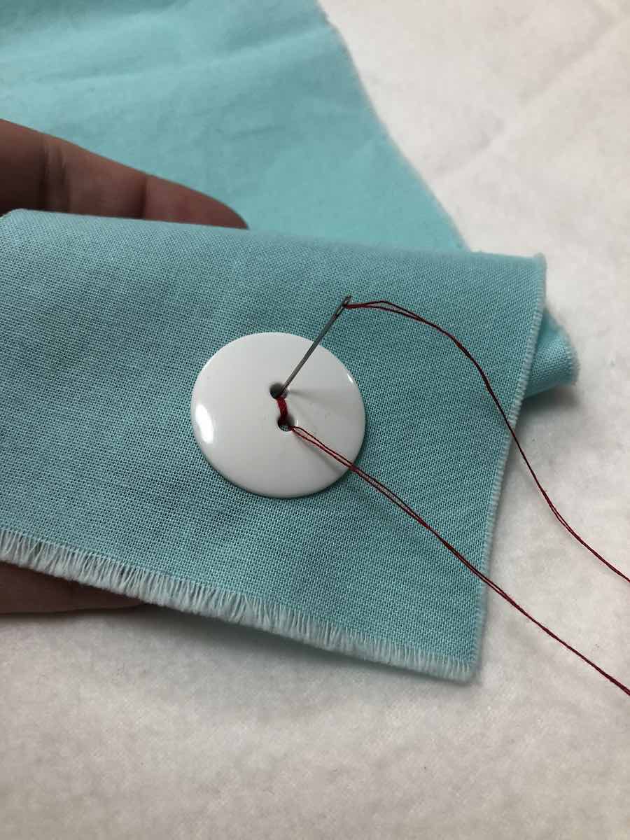 How to Sew a Twohole Button By Hand