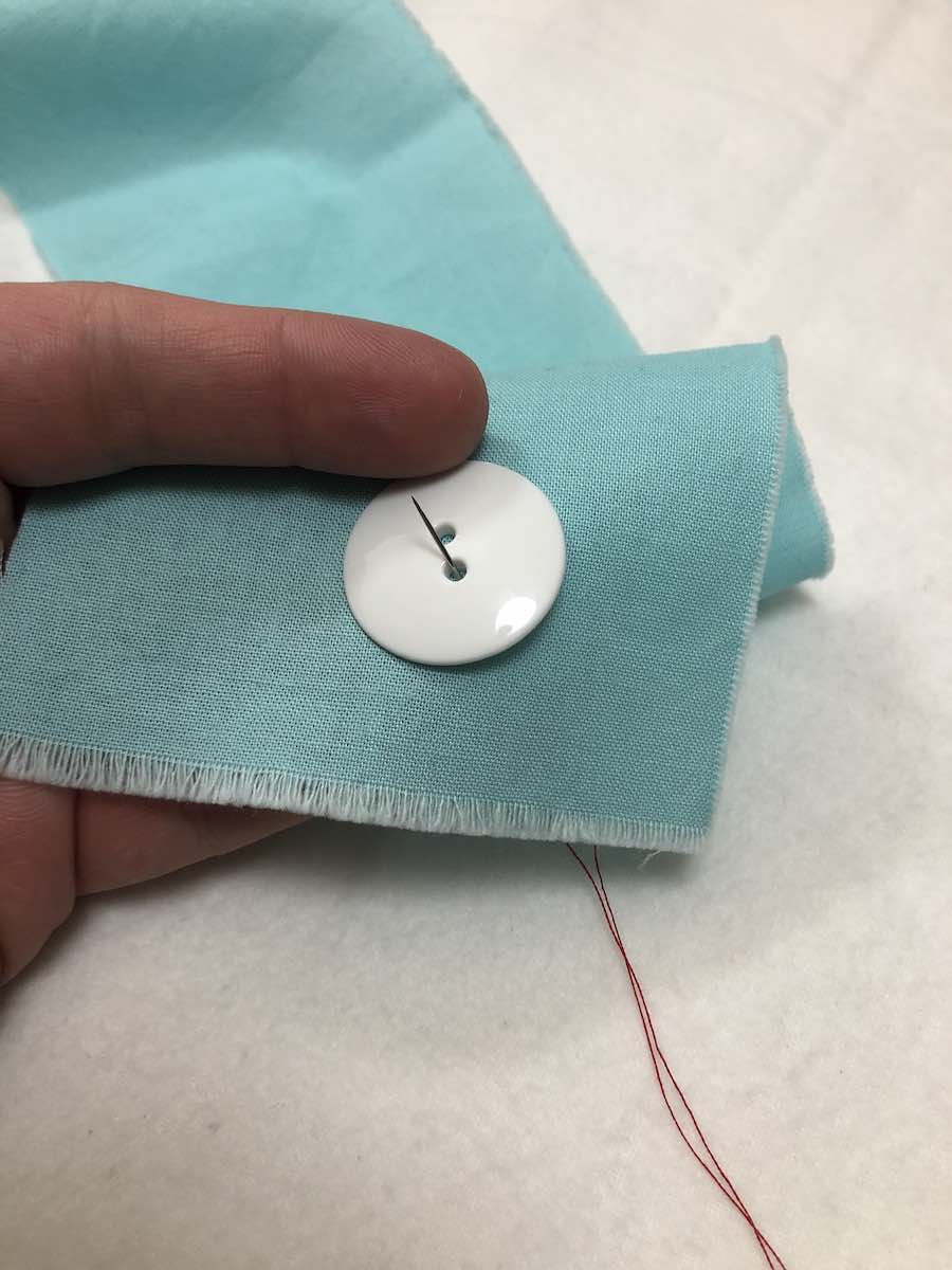 How to Sew a Twohole Button By Hand