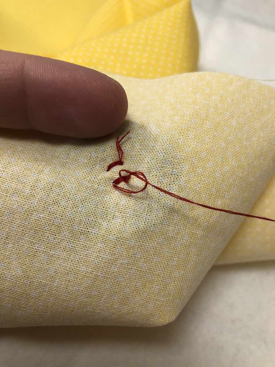 How to Sew a Fourhole Button by Hand