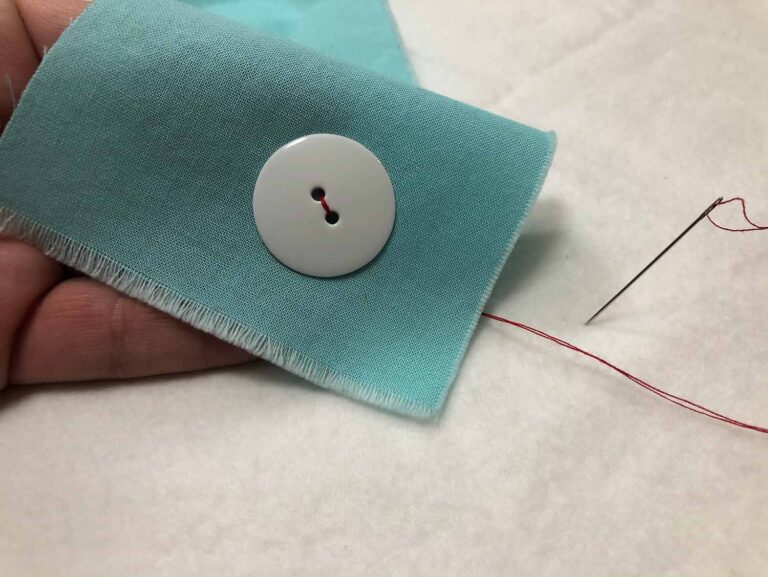 How to Sew a Twohole Button By Hand